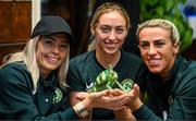 25 September 2023; Republic of Ireland players, from left, Denise O'Sullivan, Megan Connolly and Savannah McCarthy with Flash, a chameleon, at Zoo Café in Budapest, Hungary, during some down time ahead of their UEFA Women's Nations League B1 match against Hungary, on Tuesday. Photo by Stephen McCarthy/Sportsfile