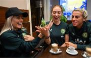 25 September 2023; Republic of Ireland players, from left, Denise O'Sullivan, Megan Connolly and Savannah McCarthy with Flash, a chameleon, at Zoo Café in Budapest, Hungary, during some down time ahead of their UEFA Women's Nations League B1 match against Hungary, on Tuesday. Photo by Stephen McCarthy/Sportsfile