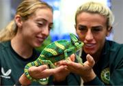 25 September 2023; Republic of Ireland's Savannah McCarthy, right, and Megan Connolly with Flash, a chameleon, at Zoo Café in Budapest, Hungary, during some down time ahead of their UEFA Women's Nations League B1 match against Hungary, on Tuesday. Photo by Stephen McCarthy/Sportsfile