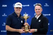 25 September 2023; USA captain Zach Johnson, left, and Europe captain Luke Donald pose with the Ryder Cup during a press conference before the 2023 Ryder Cup at Marco Simone Golf and Country Club in Rome, Italy. Photo by Ramsey Cardy/Sportsfile