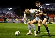25 September 2023; Gavin Molloy of Shelbourne in action against James McManus of Bohemians during the SSE Airtricity Men's Premier Division match between Bohemians and Shelbourne at Dalymount Park in Dublin. Photo by Tyler Miller/Sportsfile