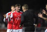 25 September 2023; St Patrick's Athletic players remonstrate with referee David Dunne after he showed a red card to Sam Curtis during the SSE Airtricity Men's Premier Division match between St Patrick's Athletic and Drogheda United at Richmond Park in Dublin. Photo by David Fitzgerald/Sportsfile