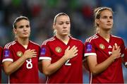 26 September 2023; Hungary players, from left, Viktória Szabó, Laura Palakovics and Hanna Németh stand for the playing of the National Anthem before the UEFA Women's Nations League B1 match between Hungary and Republic of Ireland at Hidegkuti Nándor Stadium in Budapest, Hungary. Photo by Stephen McCarthy/Sportsfile