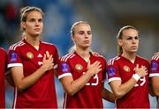 26 September 2023; Hungary players, from left, Hanna Németh, Luca Papp and Dóra Zeller stand for the playing of the National Anthem before the UEFA Women's Nations League B1 match between Hungary and Republic of Ireland at Hidegkuti Nándor Stadium in Budapest, Hungary. Photo by Stephen McCarthy/Sportsfile