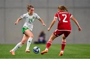 26 September 2023; Heather Payne of Republic of Ireland in action against Laura Palakovics of Hungary during the UEFA Women's Nations League B1 match between Hungary and Republic of Ireland at Hidegkuti Nándor Stadium in Budapest, Hungary. Photo by Stephen McCarthy/Sportsfile