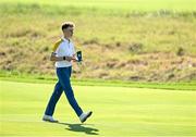 28 September 2023; Sean Keeling of Europe walks up the eighth fairway during the singles matches on day three of the Junior Ryder Cup at Marco Simone Golf and Country Club in Rome, Italy. Photo by Brendan Moran/Sportsfile