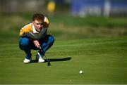 28 September 2023; Sean Keeling of Europe lines up a putt on the ninth green during the singles matches on day three of the Junior Ryder Cup at Marco Simone Golf and Country Club in Rome, Italy. Photo by Brendan Moran/Sportsfile