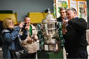 28 September 2023; Local Carrick Hill residents inspect the cup as descendants of Alton United receive the Sports Direct Men’s FAI Cup for the first time in Carrick Hill, Belfast on the 100th anniversary of the Club winning the Cup as the only Belfast team to win the competition in its history. Photo by David Fitzgerald/Sportsfile