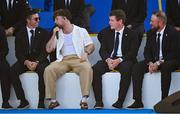 28 September 2023; Singer Tom Grennan with Rory McIlroy of Europe, left, and team-mates Robert MacIntyre and Shane Lowry during the opening ceremony of the 2023 Ryder Cup at Marco Simone Golf and Country Club in Rome, Italy. Photo by Brendan Moran/Sportsfile