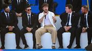 28 September 2023; Singer Tom Grennan with, from left, Jon Rahm, Rory McIlroy, Robert MacIntyre and Shane Lowry of Europe during the opening ceremony of the 2023 Ryder Cup at Marco Simone Golf and Country Club in Rome, Italy. Photo by Brendan Moran/Sportsfile