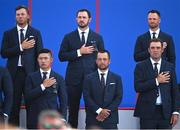 28 September 2023; USA players, back from left, Sam Burns, Patrick Cantlay and Wyndham Clark and front, form left, Collin Morikawa, Xander Schauffele and Scottie Scheffler stand for the playing of their national anthem during the opening ceremony of the 2023 Ryder Cup at Marco Simone Golf and Country Club in Rome, Italy. Photo by Brendan Moran/Sportsfile