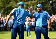 29 September 2023; Shane Lowry, right, and Sepp Straka of Europe celebrate on the ninth green during the morning foursomes matches on day one of the 2023 Ryder Cup at Marco Simone Golf and Country Club in Rome, Italy. Photo by Ramsey Cardy/Sportsfile