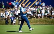 29 September 2023; Shane Lowry of Europe celebrates his pairing's victory on the 17th green, following a putt by teammate Sepp Straka, not pictured, during the morning foursomes matches on day one of the 2023 Ryder Cup at Marco Simone Golf and Country Club in Rome, Italy. Photo by Ramsey Cardy/Sportsfile
