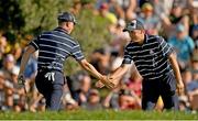 29 September 2023; Justin Thomas, right, and Jordan Spieth of USA congratulate each other on the 15th green during the afternoon fourball matches on day one of the 2023 Ryder Cup at Marco Simone Golf and Country Club in Rome, Italy. Photo by Brendan Moran/Sportsfile