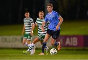 22 September 2023; Ciaran Behan of UCD in action against Liam Burt of Shamrock Rovers during the SSE Airtricity Men's Premier Division match between UCD and Shamrock Rovers at UCD Bowl in Dublin. Photo by Stephen McCarthy/Sportsfile