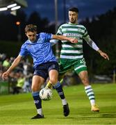 22 September 2023; Eanna Clancy of UCD in action against Neil Farrugia of Shamrock Rovers during the SSE Airtricity Men's Premier Division match between UCD and Shamrock Rovers at UCD Bowl in Dublin. Photo by Stephen McCarthy/Sportsfile