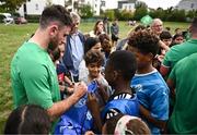 29 September 2023; Hugo Keenan signs autographs during an Ireland rugby visit to Drop Quartier Rugby ran by UST Tour Rugby in Tours, France. Photo by Harry Murphy/Sportsfile