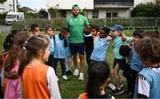 29 September 2023; Jamison Gibson-Park with children during an Ireland rugby visit to Drop Quartier Rugby ran by UST Tour Rugby in Tours, France. Photo by Harry Murphy/Sportsfile