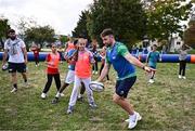 29 September 2023; Hugo Keenan with children during an Ireland rugby visit to Drop Quartier Rugby ran by UST Tour Rugby in Tours, France. Photo by Harry Murphy/Sportsfile