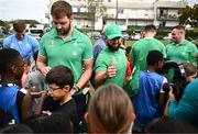 29 September 2023; Iain Henderson and Jamison Gibson-Park hand out gifts during an Ireland rugby visit to Drop Quartier Rugby ran by UST Tour Rugby in Tours, France. Photo by Harry Murphy/Sportsfile