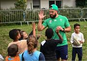 29 September 2023; Jamison Gibson-Park with children during an Ireland rugby visit to Drop Quartier Rugby ran by UST Tour Rugby in Tours, France. Photo by Harry Murphy/Sportsfile