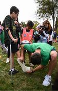29 September 2023; Hugo Keenan signs a leg cast during an Ireland rugby visit to Drop Quartier Rugby ran by UST Tour Rugby in Tours, France. Photo by Harry Murphy/Sportsfile