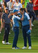 29 September 2023; Justin Rose of Europe, right, is congratulated by team captain Luke Donald on the 18th green after sinking a putt to win the hole and tie his match during the afternoon fourball matches on day one of the 2023 Ryder Cup at Marco Simone Golf and Country Club in Rome, Italy. Photo by Brendan Moran/Sportsfile