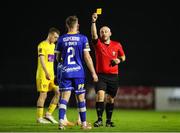 29 September 2023; Darragh Power of Waterford is shown a yellow card by referee Daryl Carolan during the SSE Airtricity Men's First Division match between Waterford and Wexford at RSC in Waterford. Photo by Michael P Ryan/Sportsfile