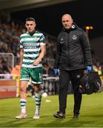 29 September 2023; Gary O'Neill of Shamrock Rovers leaves the pitch, accompanied by physiotherapsit Tony McCarthy, after picking up an injury during the SSE Airtricity Men's Premier Division match between Shamrock Rovers and Shelbourne at Tallaght Stadium in Dublin. Photo by Stephen McCarthy/Sportsfile