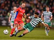 29 September 2023; Roberto Lopes of Shamrock Rovers in action against Mark Coyle of Shelbourne during the SSE Airtricity Men's Premier Division match between Shamrock Rovers and Shelbourne at Tallaght Stadium in Dublin. Photo by Stephen McCarthy/Sportsfile