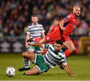 29 September 2023; Roberto Lopes of Shamrock Rovers in action against Mark Coyle of Shelbourne during the SSE Airtricity Men's Premier Division match between Shamrock Rovers and Shelbourne at Tallaght Stadium in Dublin. Photo by Stephen McCarthy/Sportsfile