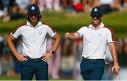 30 September 2023; Rory McIlroy, right, and partner Tommy Fleetwood of Europe on the 17th greenduring the morning foursomes on day two of the 2023 Ryder Cup at Marco Simone Golf and Country Club in Rome, Italy. Photo by Brendan Moran/Sportsfile