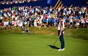 30 September 2023; Rory McIlroy of Europe celebrates a putt on the 17th hole to win the match during the morning foursomes on day two of the 2023 Ryder Cup at Marco Simone Golf and Country Club in Rome, Italy. Photo by Ramsey Cardy/Sportsfile