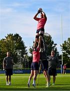 30 September 2023; Peter O’Mahony is lifted in a lineout by Dave Kilcoyne and forwards coach Paul O'Connell during an Ireland rugby squad training session at Complexe de la Chambrerie in Tours, France. Photo by Harry Murphy/Sportsfile