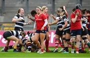 30 September 2023; Barbarians players celebrate their first try during the women's representative match between Munster and Barbarians at Thomond Park in Limerick. Photo by David Fitzgerald/Sportsfile