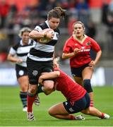 30 September 2023; Ciara Griffin of Barbarians is tackled by Aoife Corey of Munster during the women's representative match between Munster and Barbarians at Thomond Park in Limerick. Photo by David Fitzgerald/Sportsfile