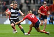 30 September 2023; Ciara Griffin of Barbarians is tackled by Aoife Corey of Munster during the women's representative match between Munster and Barbarians at Thomond Park in Limerick. Photo by David Fitzgerald/Sportsfile