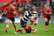 30 September 2023; Ciara Griffin of Barbarians is tackled by Aoife Corey of Munster during the women's representative match between Munster and Barbarians at Thomond Park in Limerick. Photo by David Fitzgerald/Sportsfile
