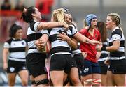 30 September 2023; Megan Gaffney of Barbarians, centre, is congratulated by teammates after scoring their side's fourth try during the women's representative match between Munster and Barbarians at Thomond Park in Limerick. Photo by David Fitzgerald/Sportsfile