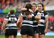 30 September 2023; Maria Magatti of Barbarians, centre, is congratulated by teammate Ailsa Hughes after scoring their side's sixth try during the women's representative match between Munster and Barbarians at Thomond Park in Limerick. Photo by David Fitzgerald/Sportsfile