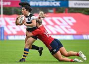30 September 2023; Kate Alder of Barbarians is tackled by Aoife Corey of Munster during the women's representative match between Munster and Barbarians at Thomond Park in Limerick. Photo by David Fitzgerald/Sportsfile