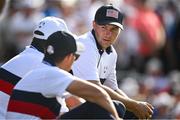 30 September 2023; Jordan Spieth of USA speaks to team-mates Scottie Scheffler and Rickie Fowler during the afternoon fourball matches on day two of the 2023 Ryder Cup at Marco Simone Golf and Country Club in Rome, Italy. Photo by Brendan Moran/Sportsfile