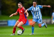 30 September 2023; Leah Doyle of Shelbourne in action against Bronagh Kane of DLR Waves  during the SSE Airtricity Women's Premier Division match between DLR Waves FC and Shelbourne FC at UCD Bowl in Dublin. Photo by Tyler Miller/Sportsfile