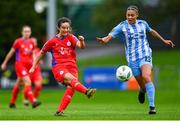 30 September 2023; Alex Kavanagh of Shelbourne in action against Neema Nyangasi of DLR Waves during the SSE Airtricity Women's Premier Division match between DLR Waves FC and Shelbourne FC at UCD Bowl in Dublin. Photo by Tyler Miller/Sportsfile