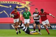 30 September 2023; Shay McCarthy of Munster is tackled by Virimi Vakatawa of Barbarians during the representative match between Munster and Barbarians at Thomond Park in Limerick. Photo by David Fitzgerald/Sportsfile