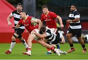 30 September 2023; Shane Daly of Munster is tackled by Baptiste Heguy of Barbarians during the representative match between Munster and Barbarians at Thomond Park in Limerick. Photo by David Fitzgerald/Sportsfile