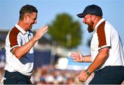 30 September 2023; Justin Rose of Europe celebrates with team-mate Shane Lowry after winning his match on the 16th hole during the afternoon fourball matches on day two of the 2023 Ryder Cup at Marco Simone Golf and Country Club in Rome, Italy. Photo by Brendan Moran/Sportsfile