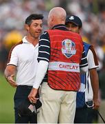 30 September 2023; Rory McIlroy of Europe speaks to Joe LaCava, caddie for Patrick Cantlay of USA, after their match during the afternoon fourball matches on day two of the 2023 Ryder Cup at Marco Simone Golf and Country Club in Rome, Italy. Photo by Brendan Moran/Sportsfile