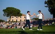 30 September 2023; Robert MacIntyre, left, and Justin Rose of Europe celebrate on the 15th green during the afternoon fourball matches on day two of the 2023 Ryder Cup at Marco Simone Golf and Country Club in Rome, Italy. Photo by Ramsey Cardy/Sportsfile