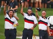 30 September 2023; Team USA players, from left, Collin Morikawa, Max Homa and Justin Thomas celebrate after team-mate Patrick Cantlay wins his match during the afternoon fourball matches on day two of the 2023 Ryder Cup at Marco Simone Golf and Country Club in Rome, Italy. Photo by Brendan Moran/Sportsfile